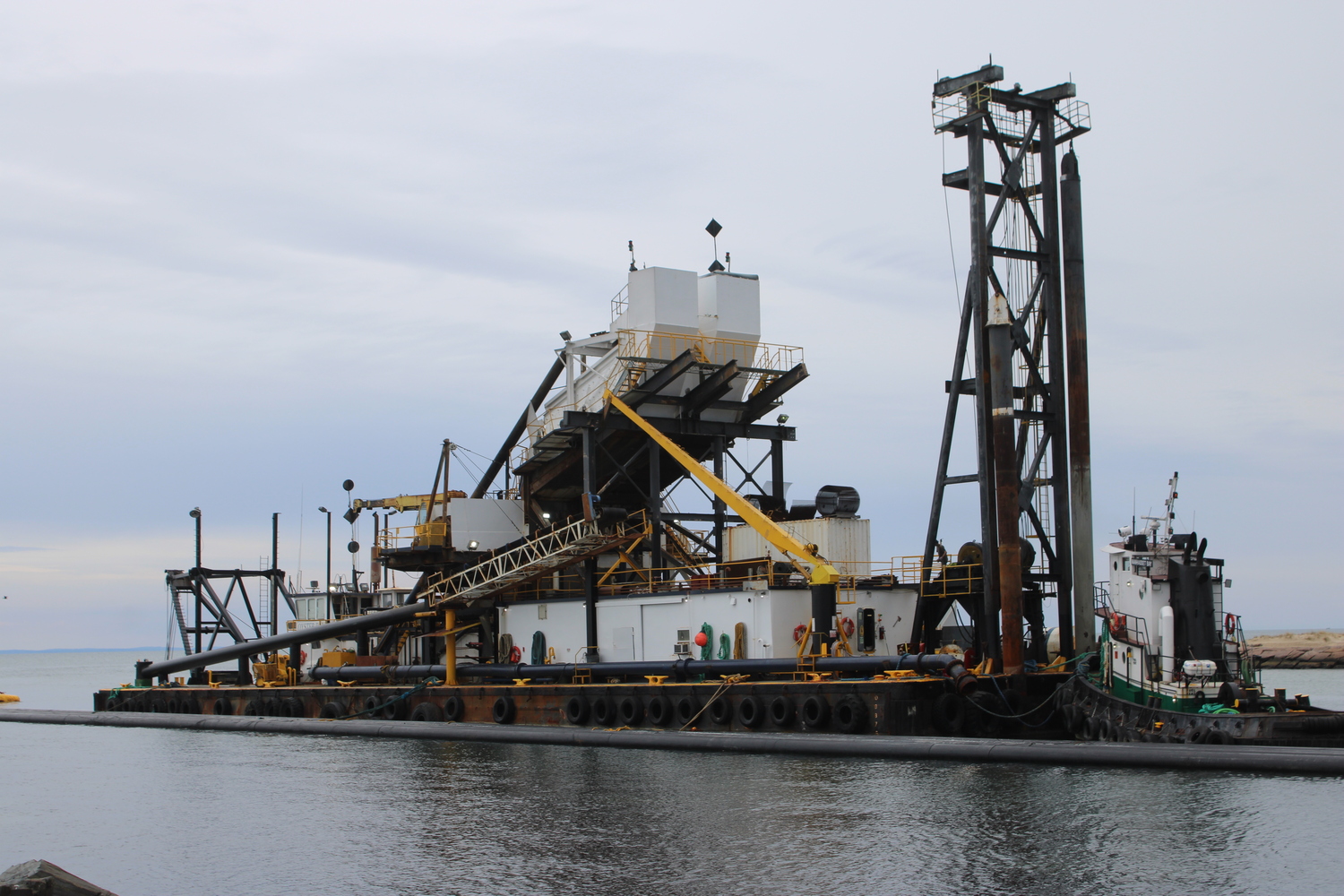 Dredge Oyster Bay in Lake Montauk Inlet on Monday morning.