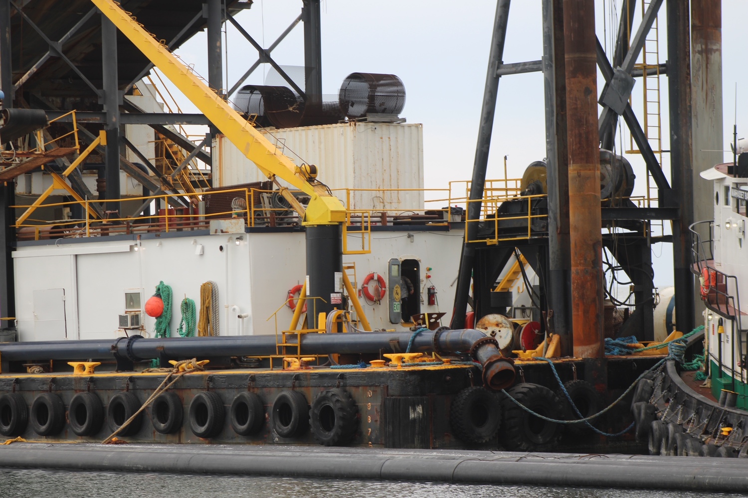 Dredge Oyster Bay sat still in Lake Montauk Inlet on Monday morning. JACK MOTZ