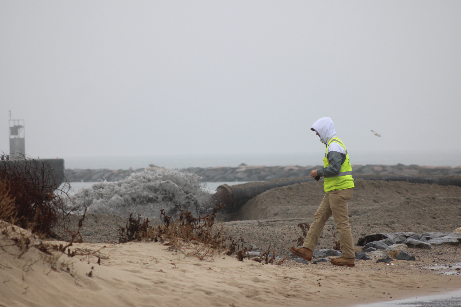 Dredging at Lake Montauk Inlet began late last week. Oyster Bay, the dredge, is pumping sand onto the beach on the west side of the inlet. Heavy machines then push and mold the sand onto the beach to fit a profile that the Army Corps of Engineers crafted. JACK MOTZ