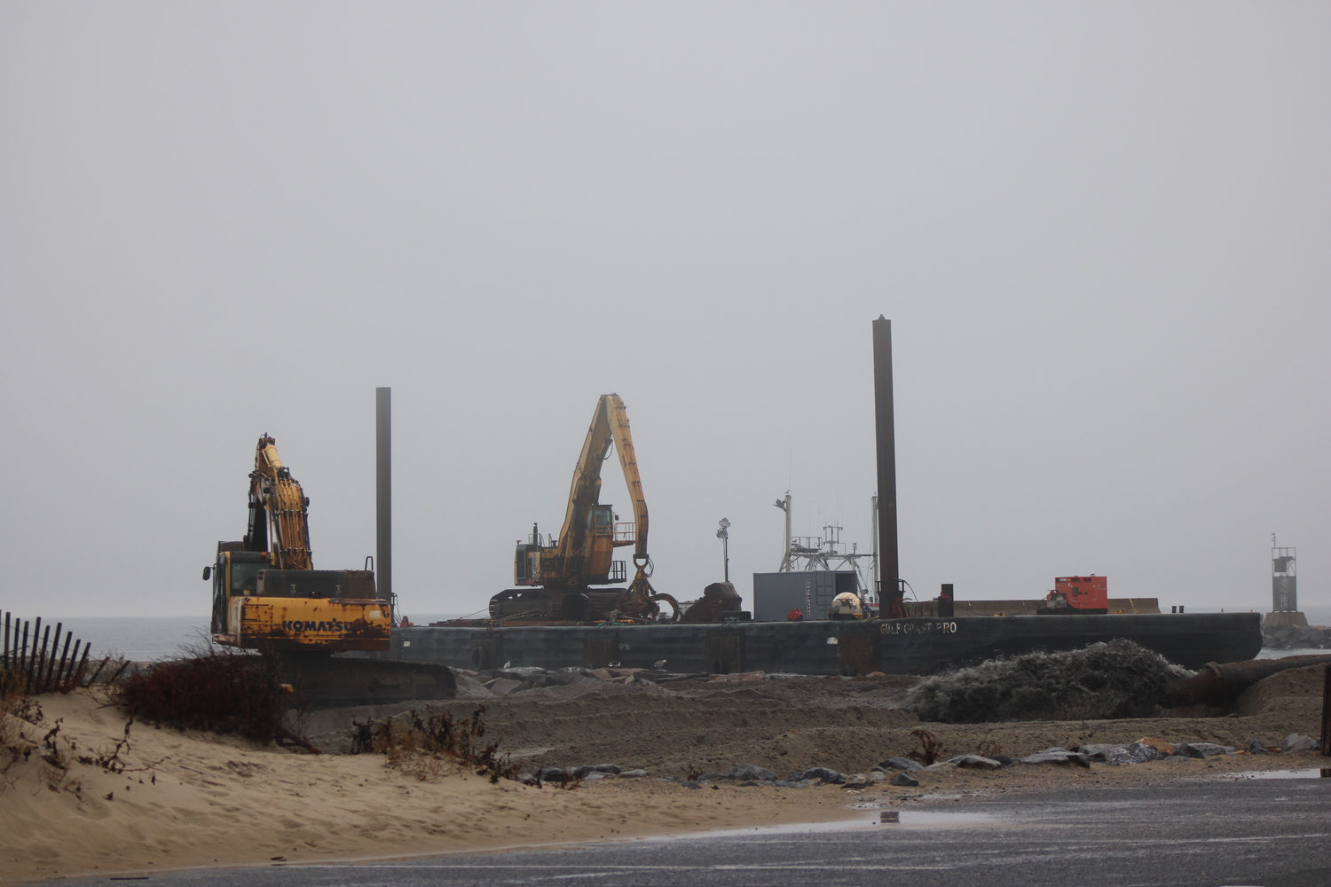 Dredging at Lake Montauk Inlet began late last week. Oyster Bay, the dredge, is pumping sand onto the beach on the west side of the inlet. Heavy machines then push and mold the sand onto the beach to fit a profile that the Army Corps of Engineers crafted. JACK MOTZ
