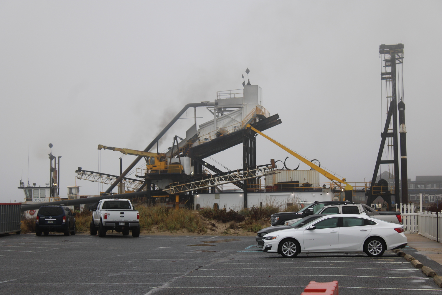 Dredge Oyster Bay as seen from the west side of the channel. The Army Corps of Engineers asked that the municipal parking lot be blocked off. JACK MOTZ