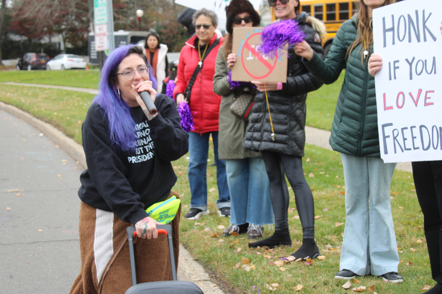 Anita Boyer, who has organized the protests, leads a chant: 
