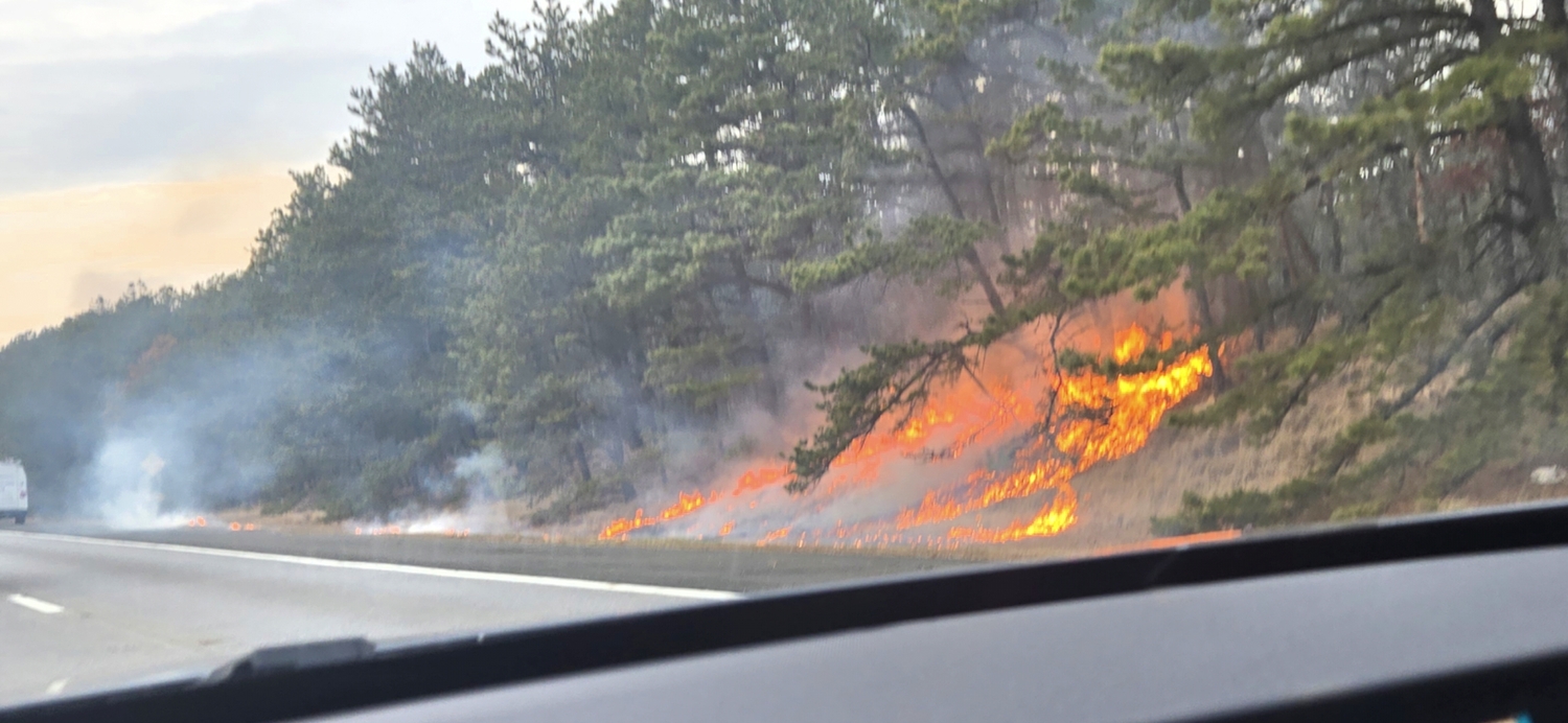 A brush fire broke out on Saturday afternoon along Sunrise Highway in East Quogue. JAMES SANDNES