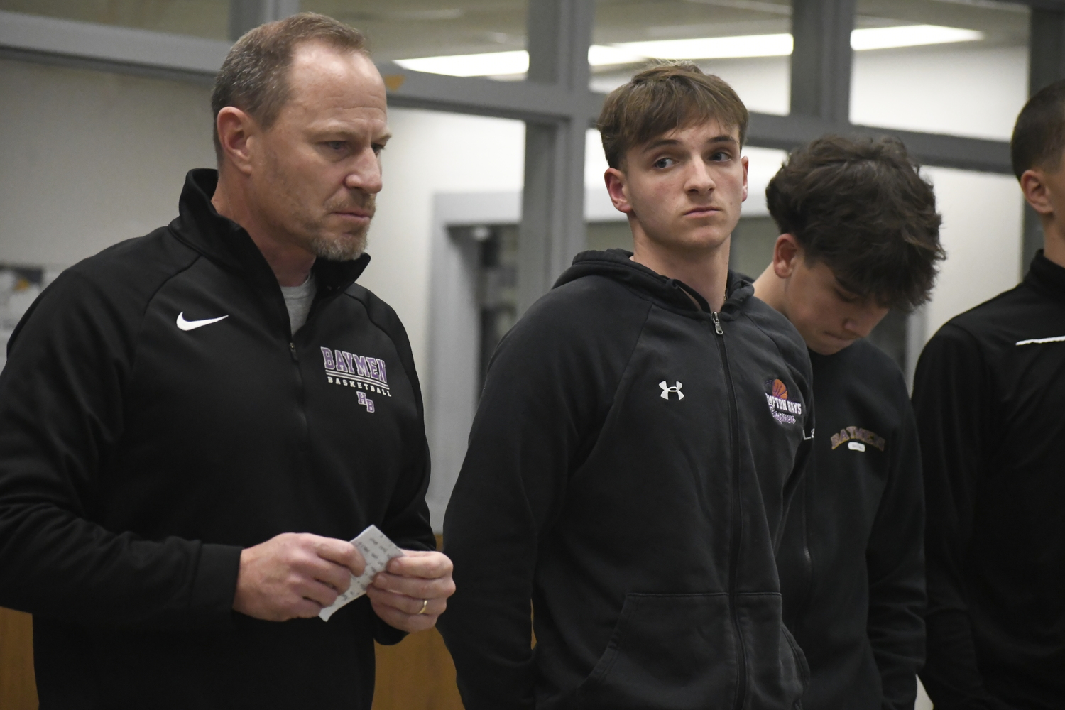 Hampton Bays head coach Noah Brown with his players Julius Lattanzio, Nate Carney and John Tedesco at the inaugural Suffolk Boys and Girls Basketball Coaches Association Media Day that was held at Sachem North High School on November 22.   DREW BUDD