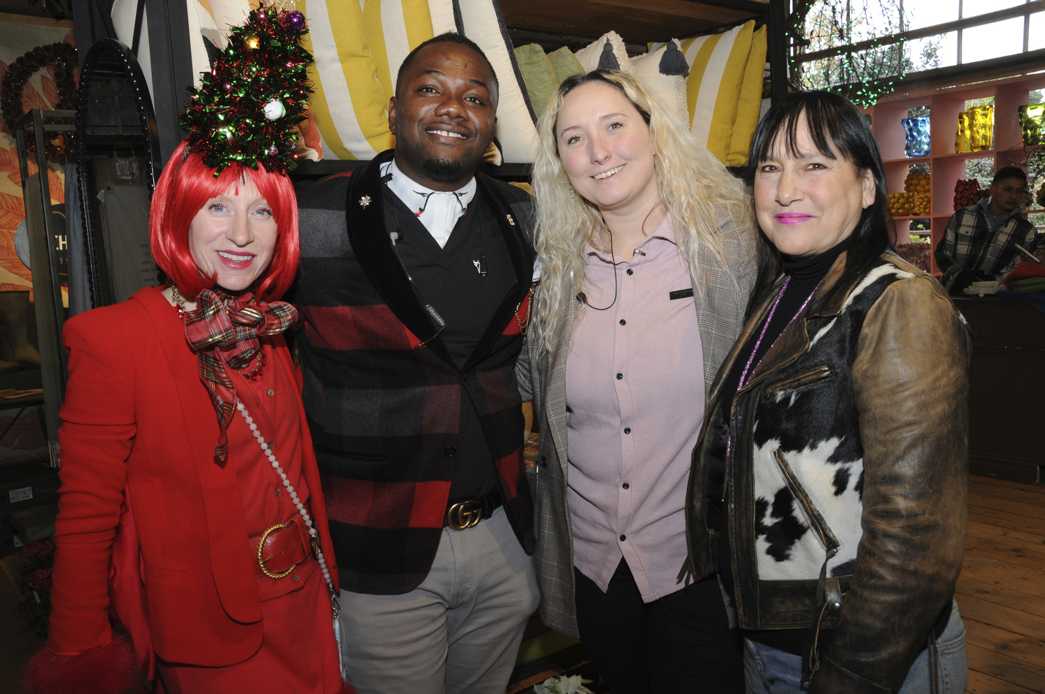 Shea Keating, Clifford Clarke, Alex Walker and Sassa Osborne at the 49th annual holiday open house at Marders in Bridgehampton on Sunday. The Genesis Ensemble, managed by Deacon Kenneth R. Brown performed.  RICHARD LEWIN