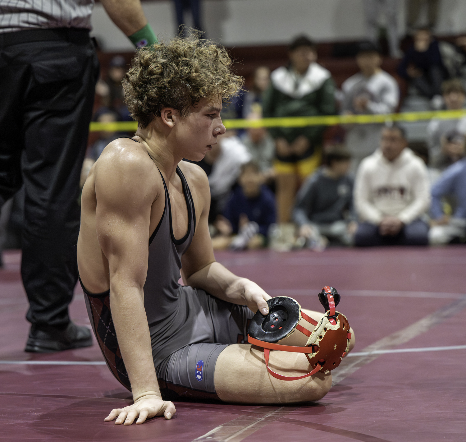 A frustrated Bronco Campsey sits on the mat during a quick break of his finals match with Ward Melville's Nick Barone.  MARIANNE BARNETT