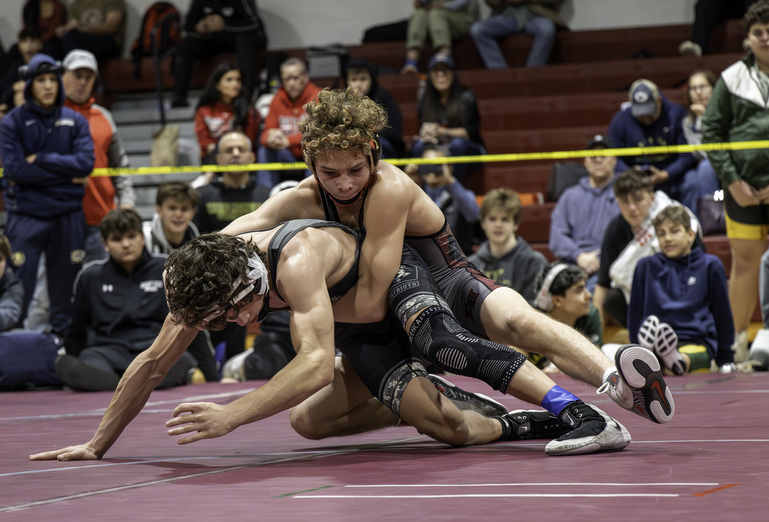 Bronco Campsey and Ward Melville's Nick Barone put on a show in the 126-pound finals, a match Barone outlasted Campsey in four overtimes.  MARIANNE BARNETT