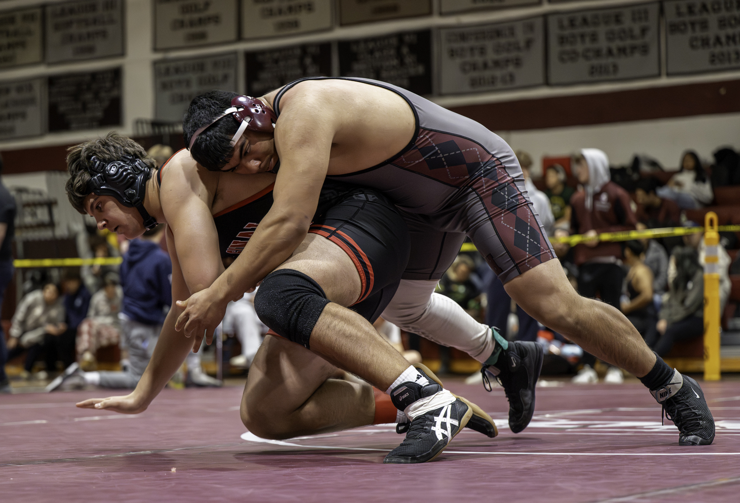 East Hampton senior Juan Espinoza takes down his Mount Sinai opponent.  MARIANNE BARNETT