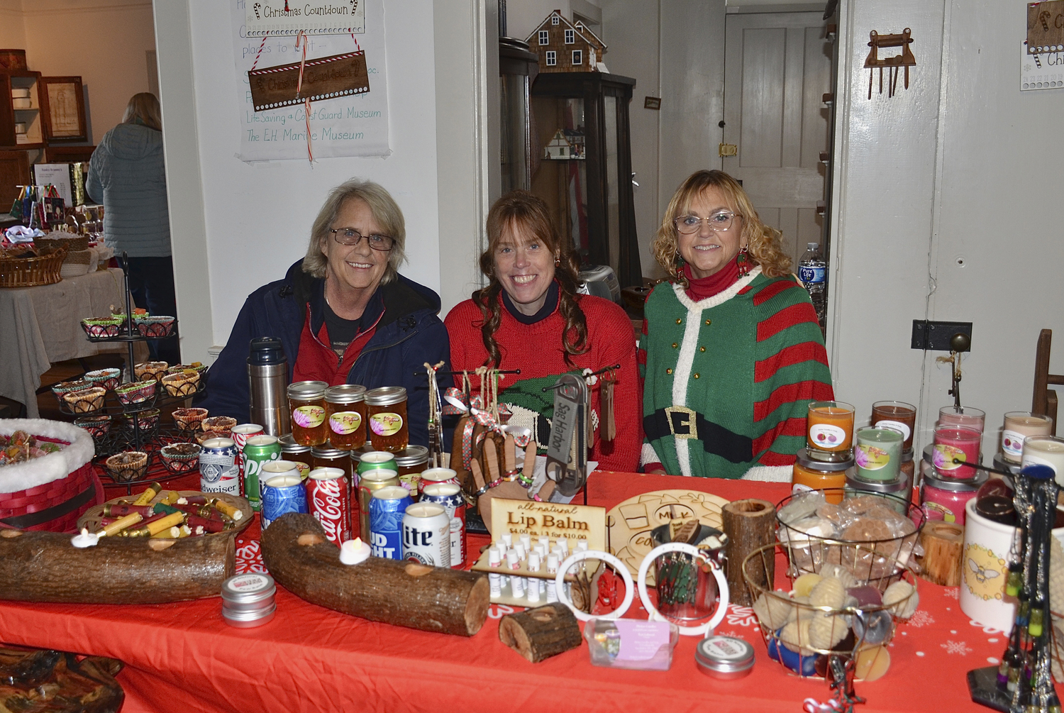 Teri, Leslie, and Cheryl Labruzzi at the East Hampton Farm Museum's Community Christmas Party on Saturday.  KYRIL BROMLEY