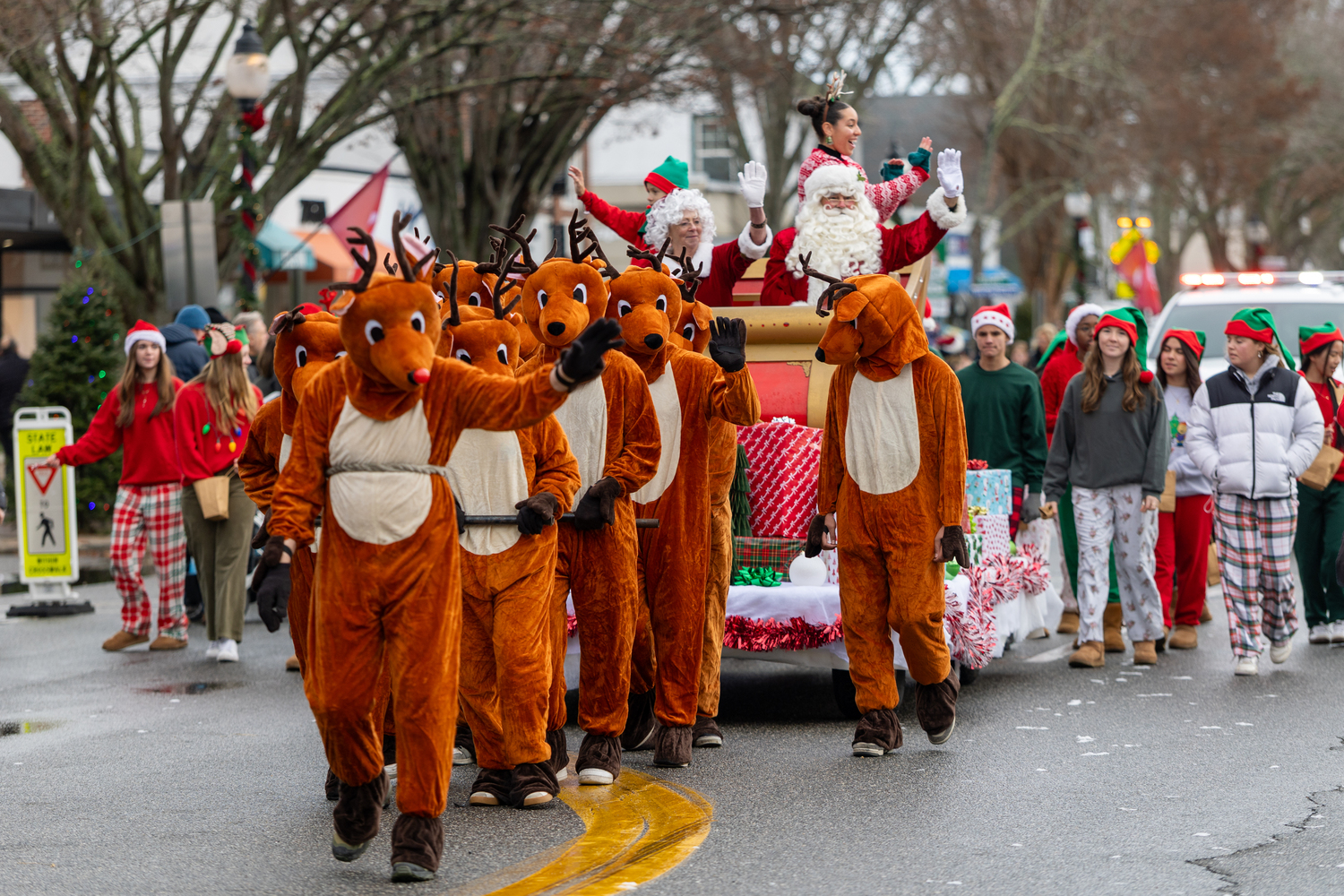 Santa, led by his reindeer in the parade on Saturday in East Hampton Village.  RON ESPOSITO