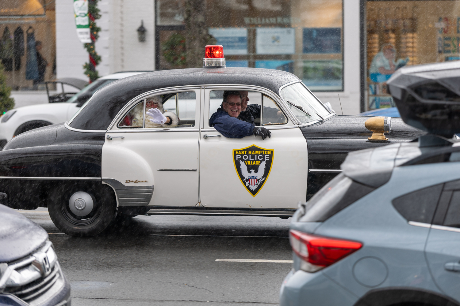 Santa get a ride to the parade with with East Hampton Village Mayor Jerry Larsen.  RON ESPOSITO