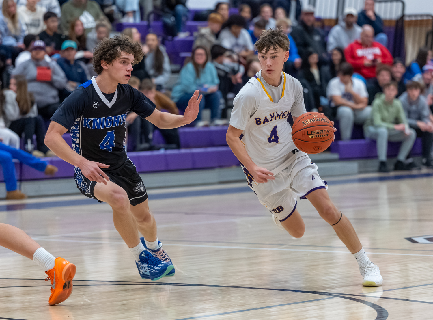 Kyle Gorman drives on Smithtown Christian's Luke Ruggiero.  RON ESPOSITO
