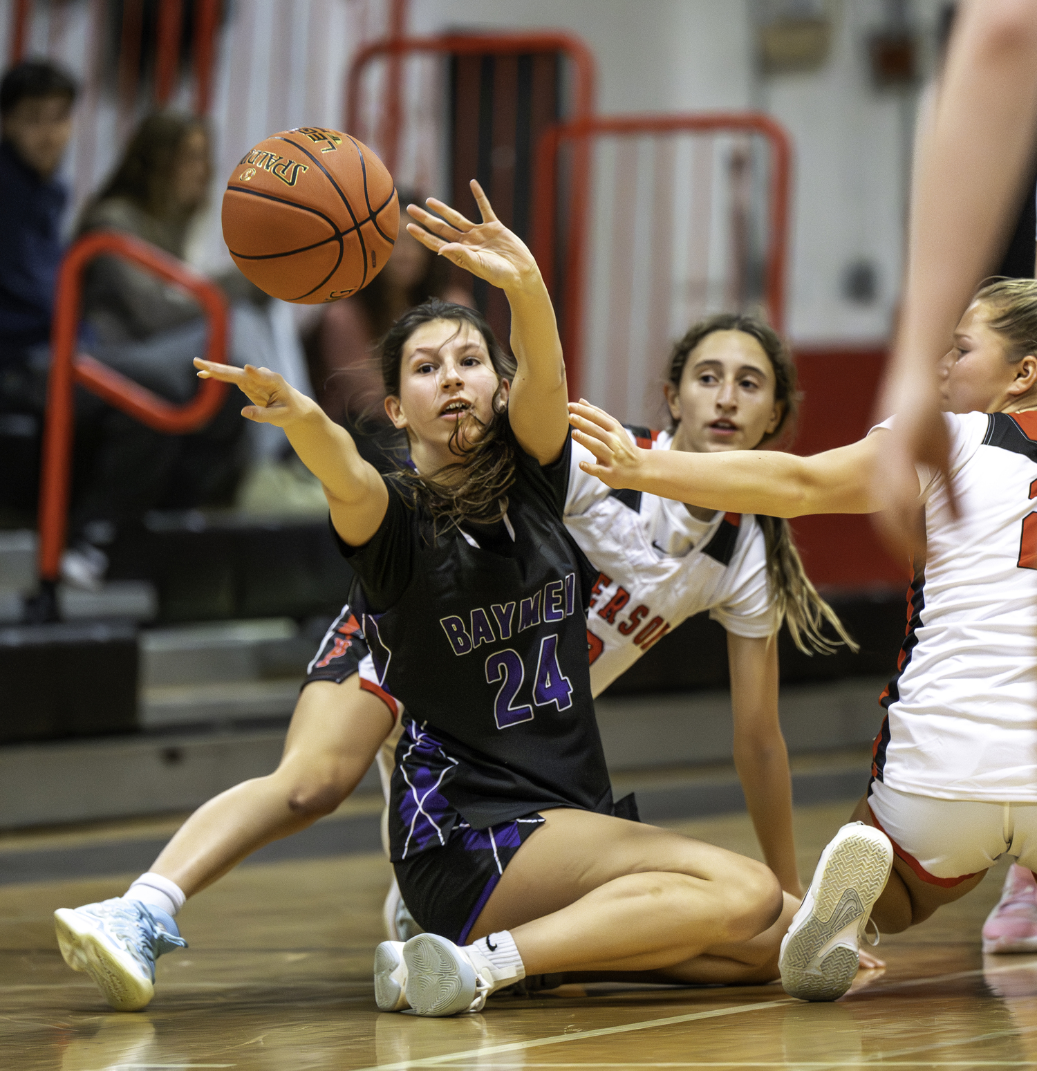 Hampton Bays junior Lee Brumagim passes after grabbing a loose ball.  MARIANNE BARNETT