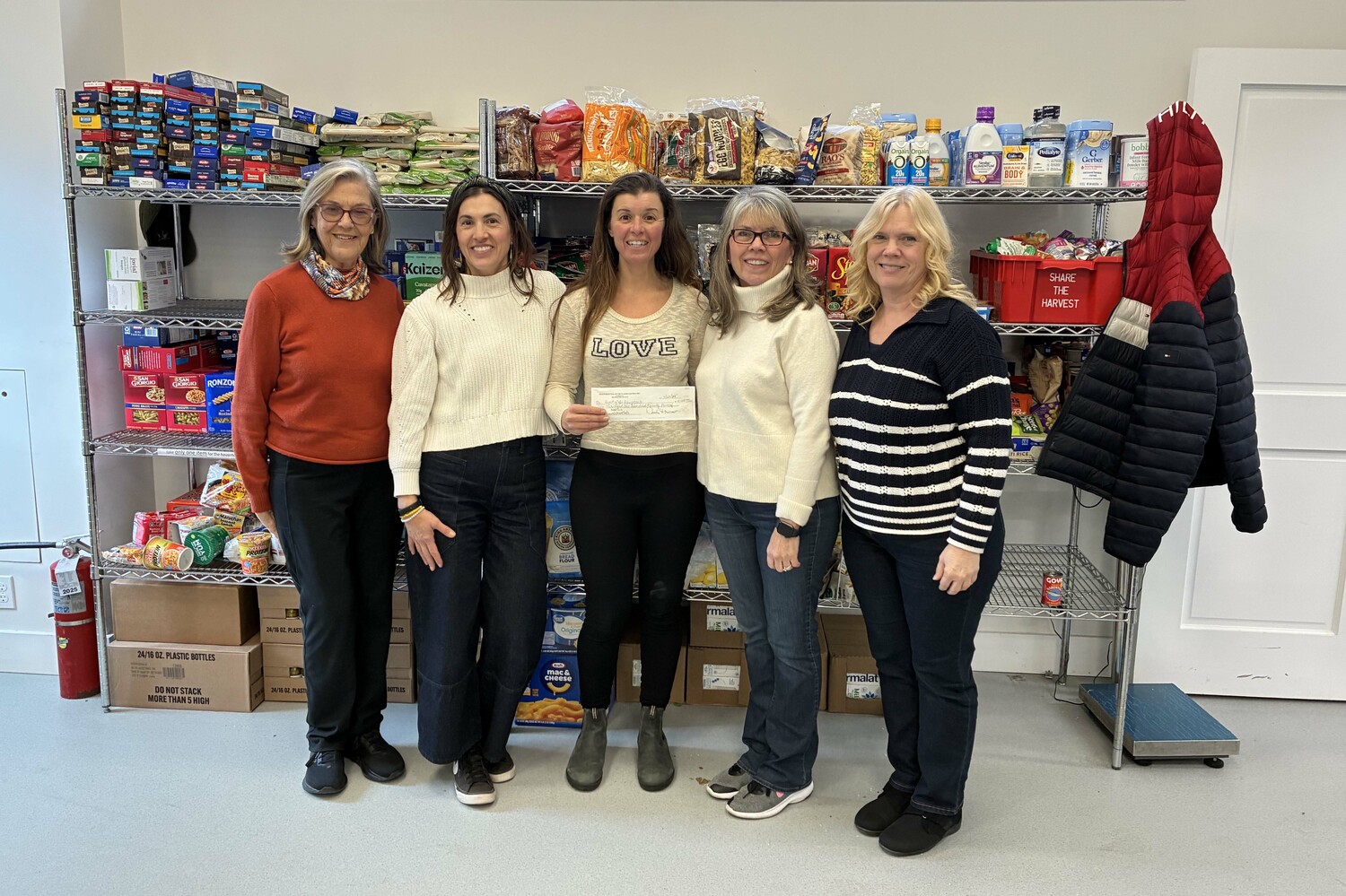 Southampton Artists Association presented a check for $10,125, raised by the sales at the Art of the Heart fundraiser, to Heart of the Hamptons food pantry.  From left, the association's Outreach Committee Chair Jean Mahoney, Heart of the Hamptons Program Coordinator Robin Preiato, Heart of the Hamptons Executive Director Molly Bishop, SAA Exhibition Committee Chair Diane White and SAA President Danielle Leef. COURTESY SOUTHAMPTON ARTISTS ASSOCIATION