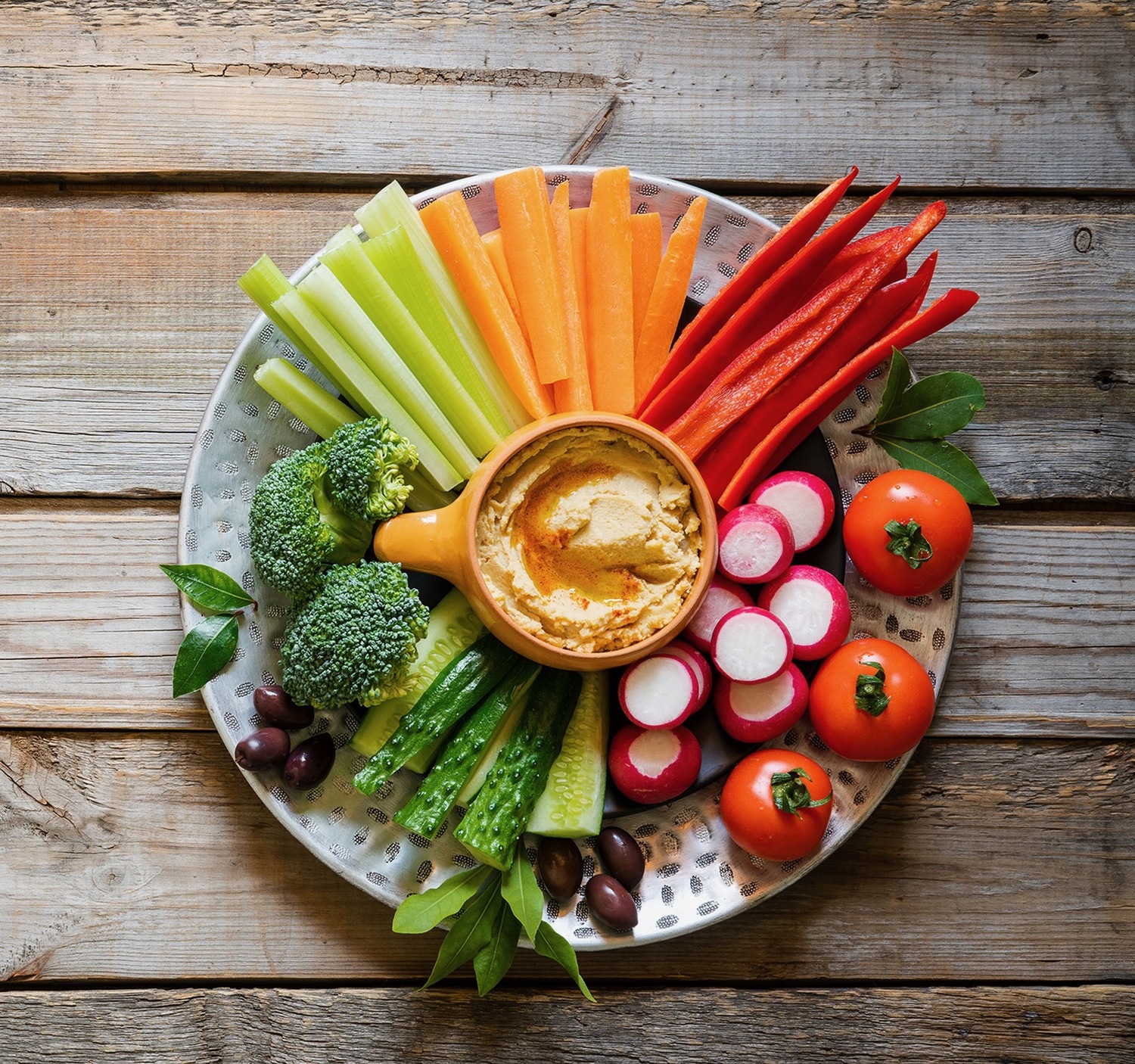 In trying to strike a balance in enjoying the holiday season, but continuing to take care of yourself, consider offering veggie or fruit platters as an alternative to holiday sweets.