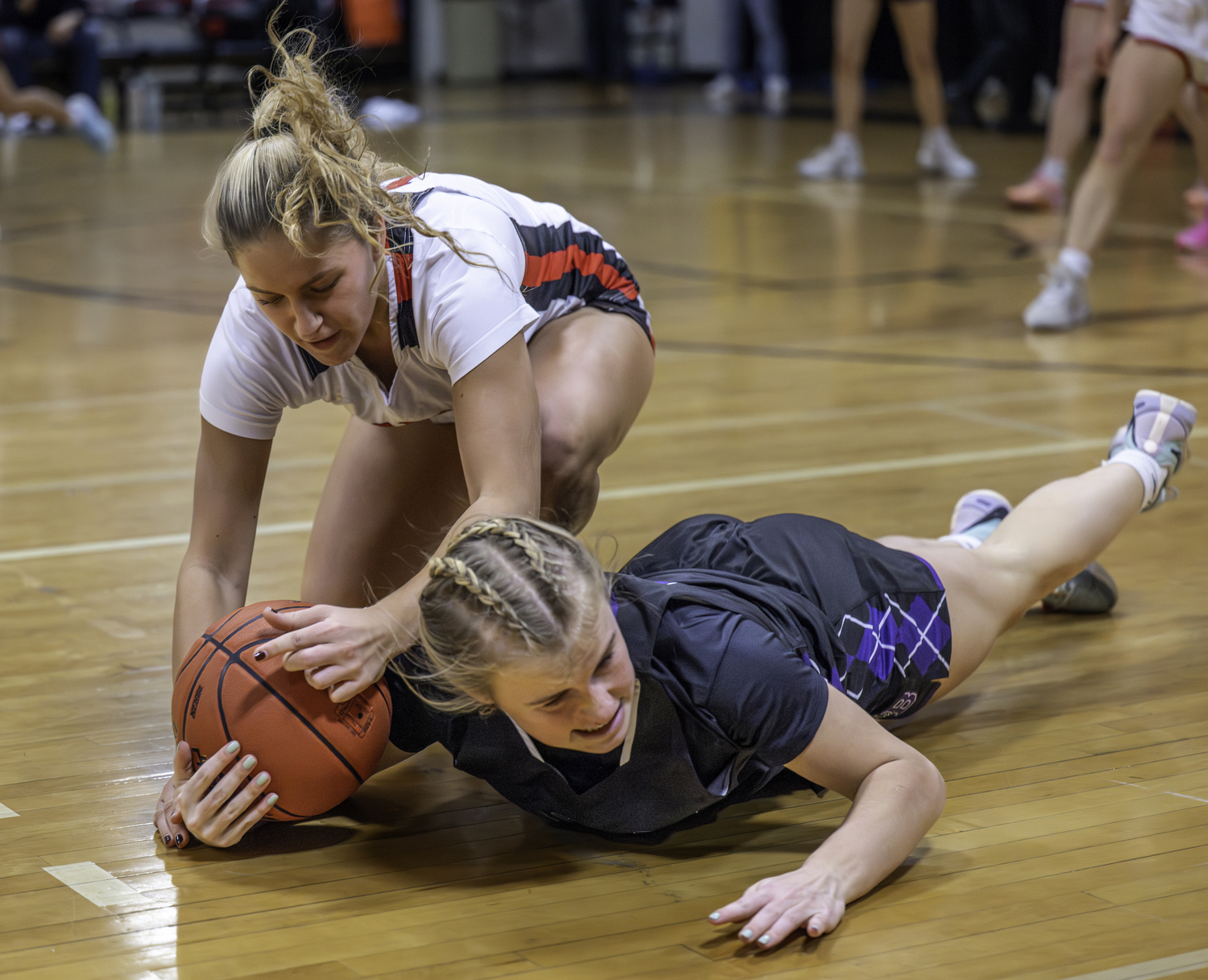 Pierson junior Lola Eldridge steals the ball from Hampton Bays senior Taylor Meyers.  MARIANNE BARNETT