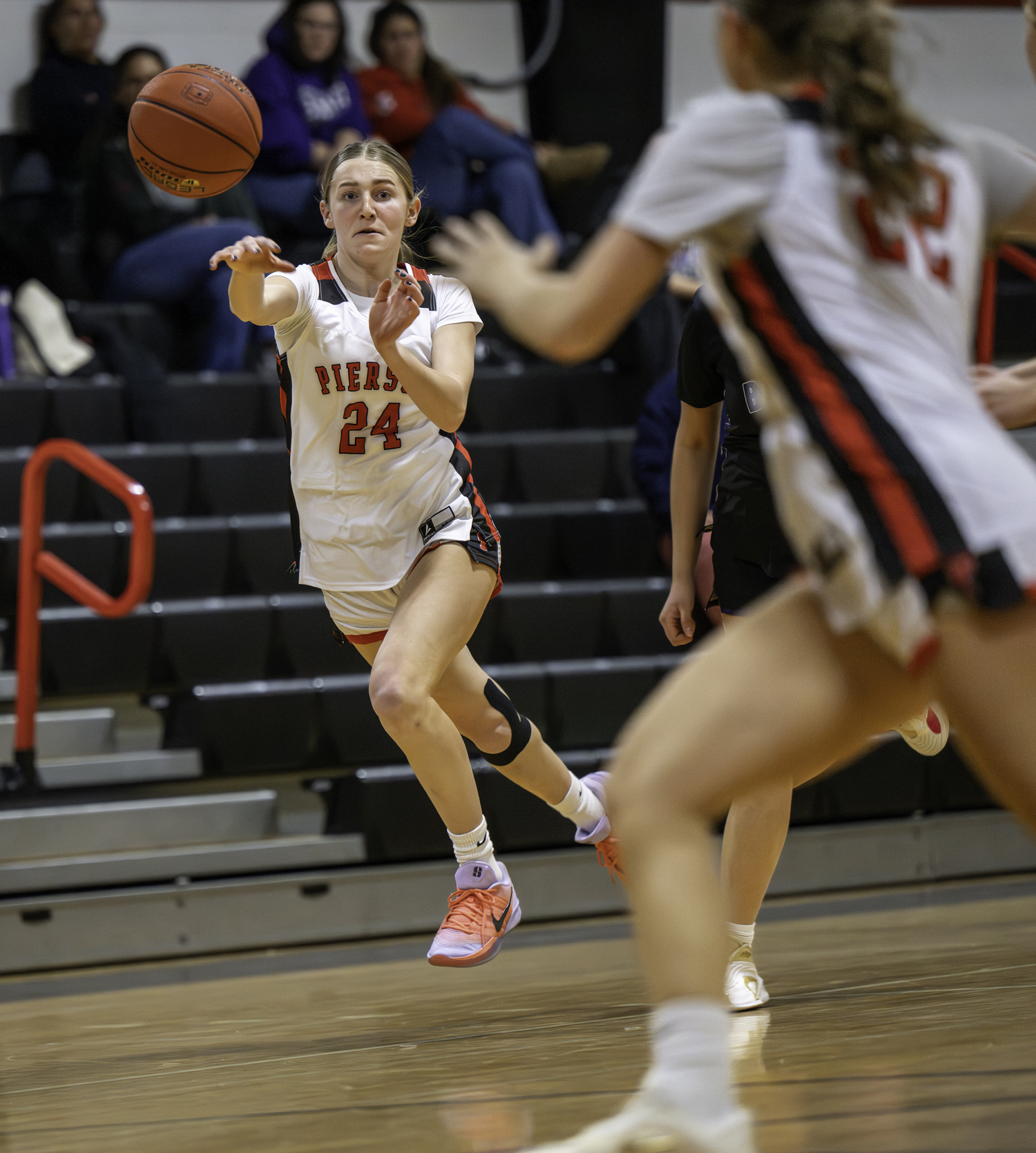 Pierson sophomore Maggie Greenwald tosses an outlet pass to classmate Georgie Finelli.  MARIANNE BARNETT