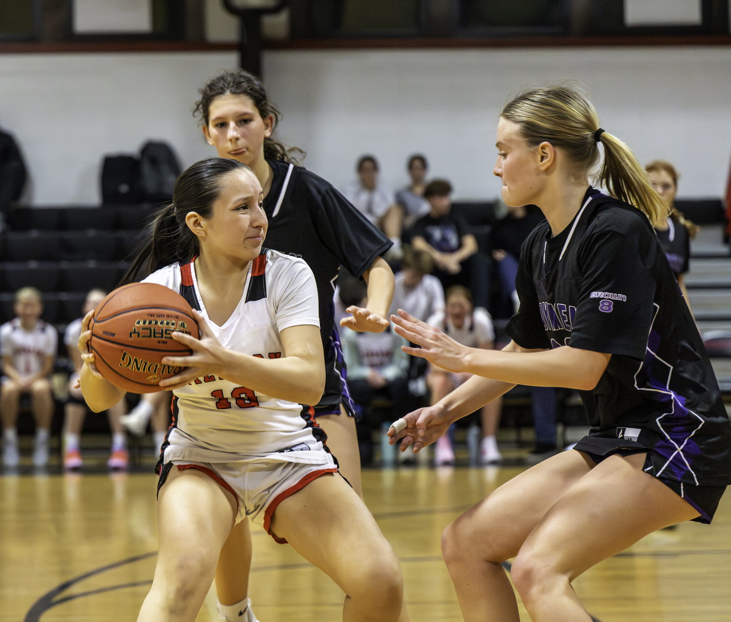 Pierson junior Evolet Sigcha is covered by a pair of Baymen. MARIANNE BARNETT