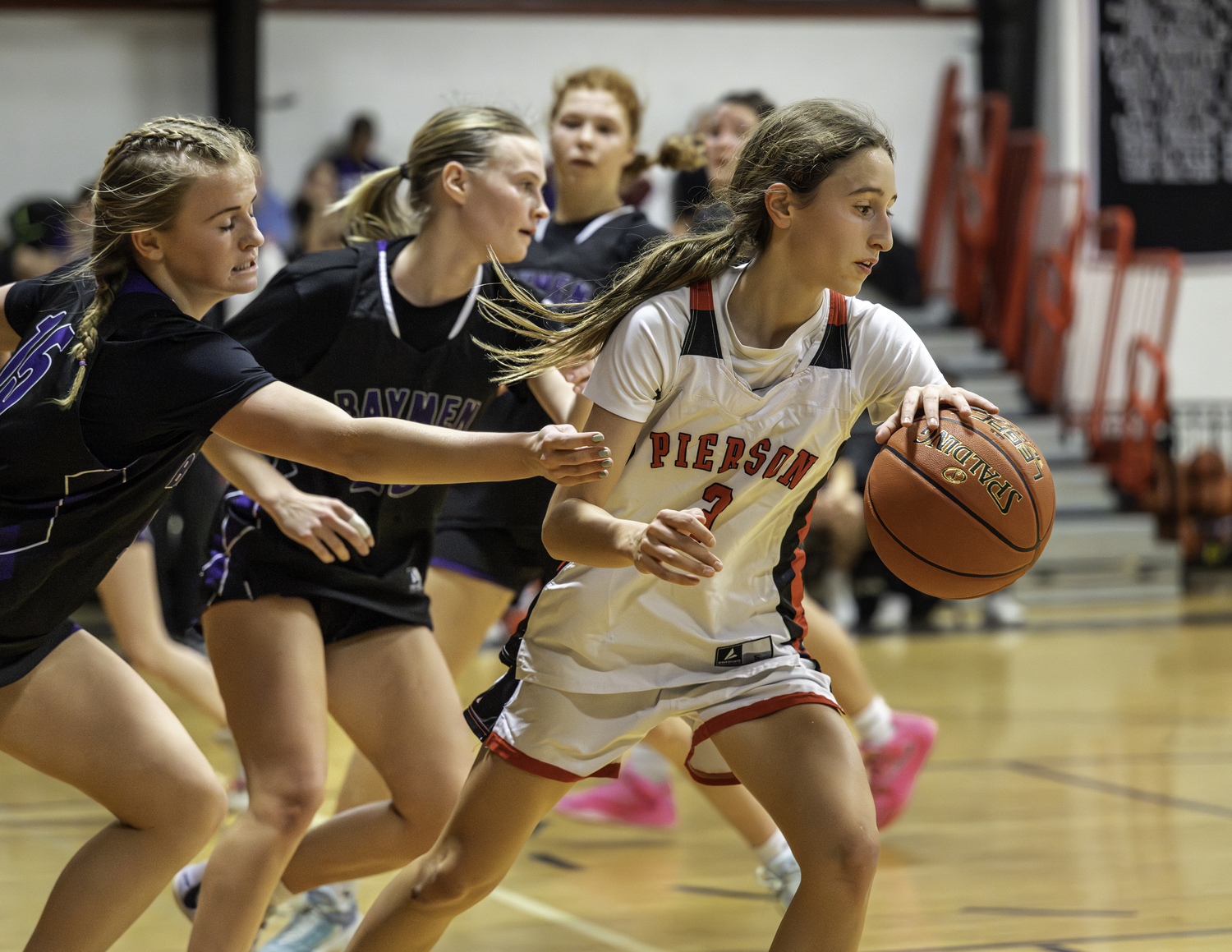 Pierson sophomore Molly Wolfson peels off after being pursued by a pair of Baymen defenders.  MARIANNE BARNETT
