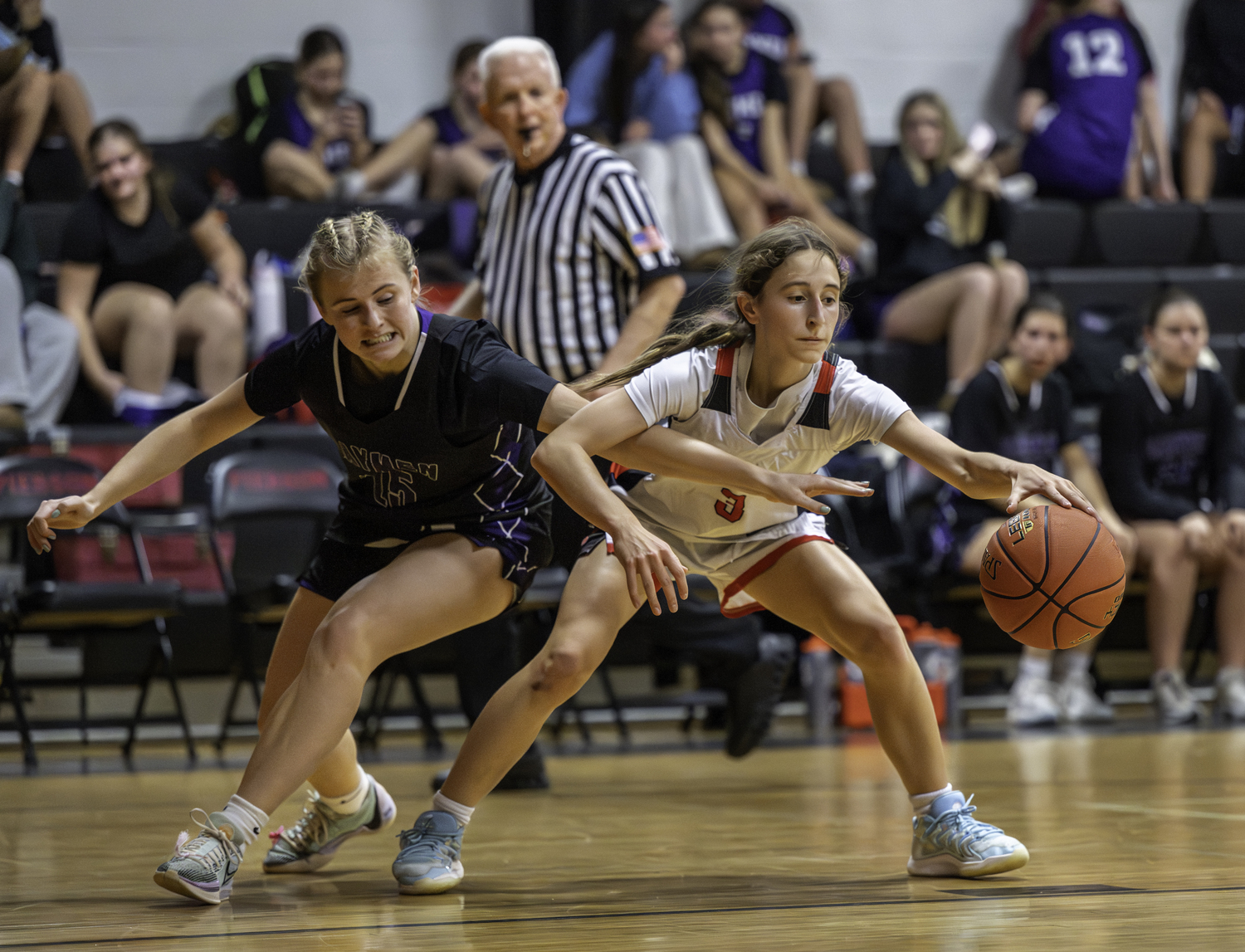 Pierson sophomore Molly Wolfson tries to keep the ball away from Hampton Bays senior Taylor Meyers.  MARIANNE BARNETT
