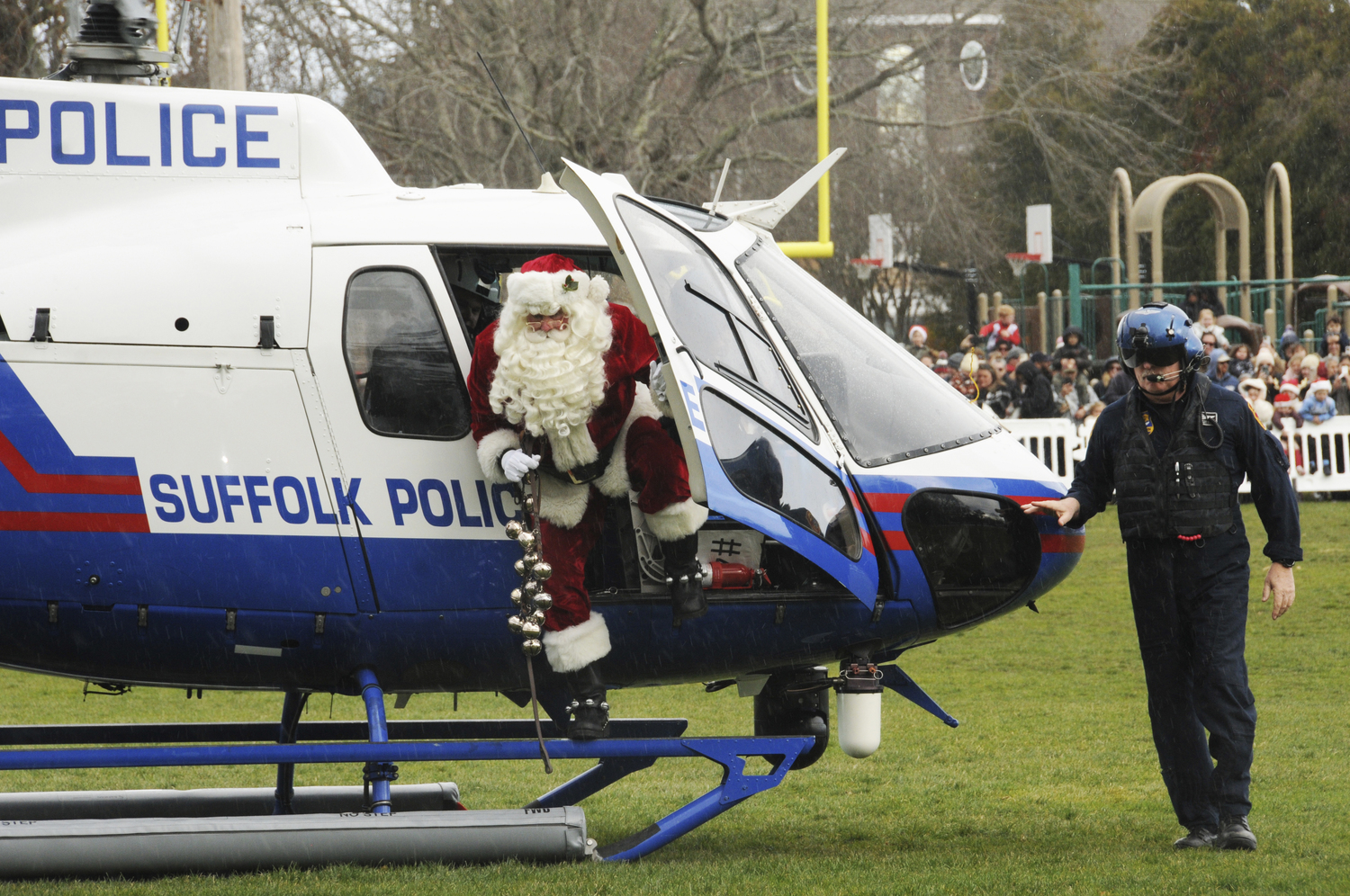 Santa arrives via helicopter in Herrick Park on Saturday in East Hampton Village.  RICHARD LEWIN