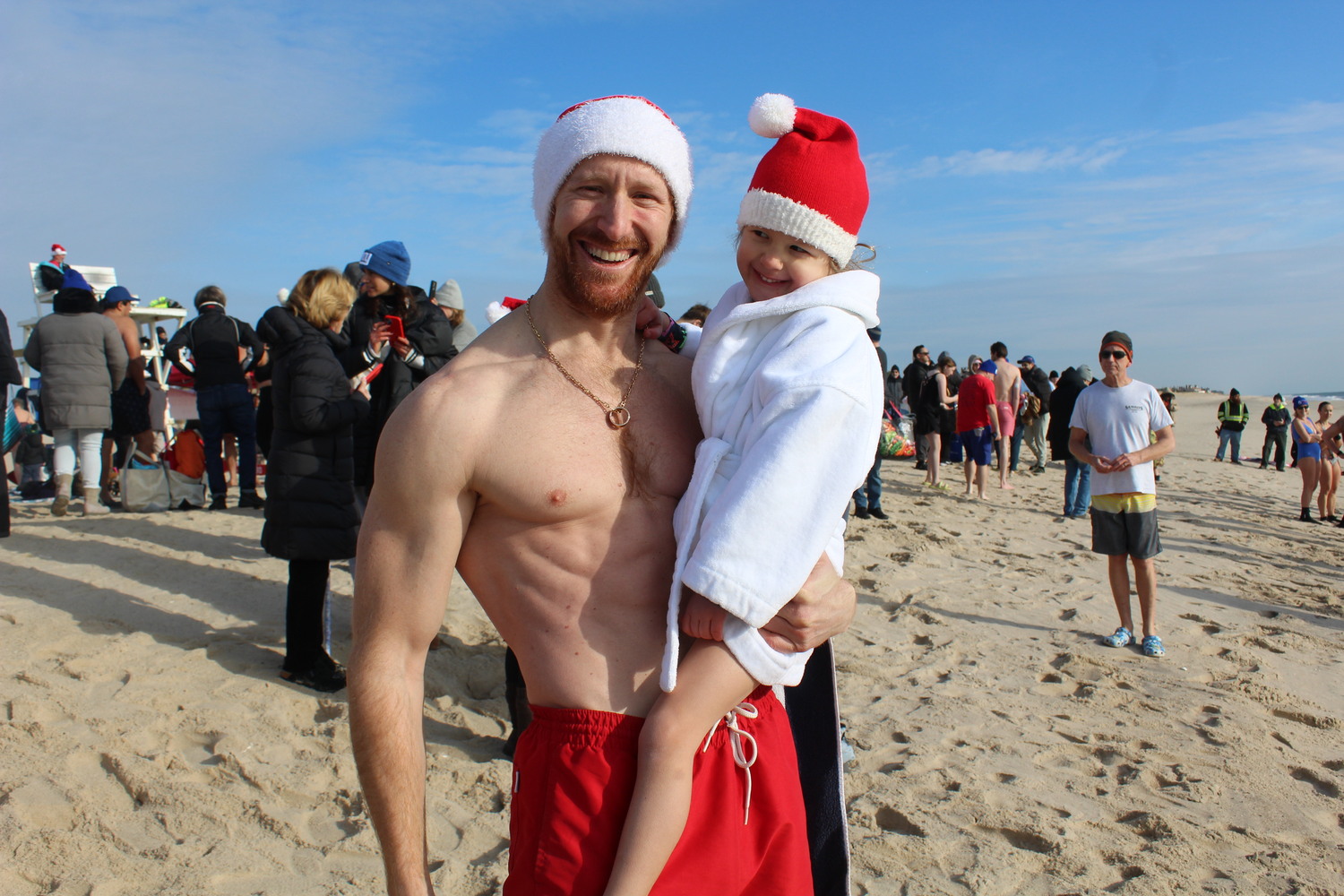 Spencer and Sadie Korwin at he Polar Bear Plunge at Coopers Beach on Saturday.  LEE MEYER