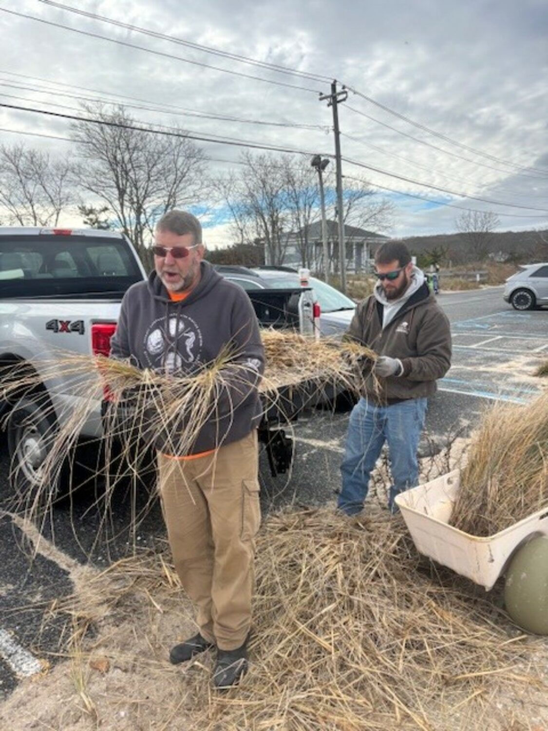 Steve Schott and Jason Havelin from Cornell Cooperative Extension doing their part. COURTESY TOWN OF SOUTHAMPTON