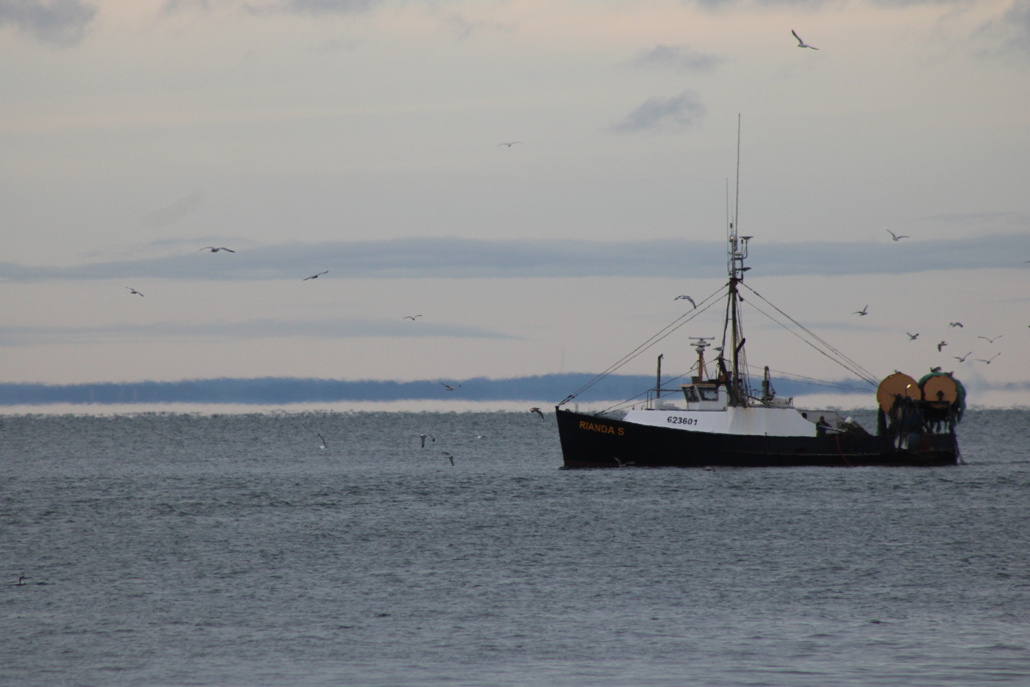 A boat arrives outside the inlet on Friday afternoon. JACK MOTZ