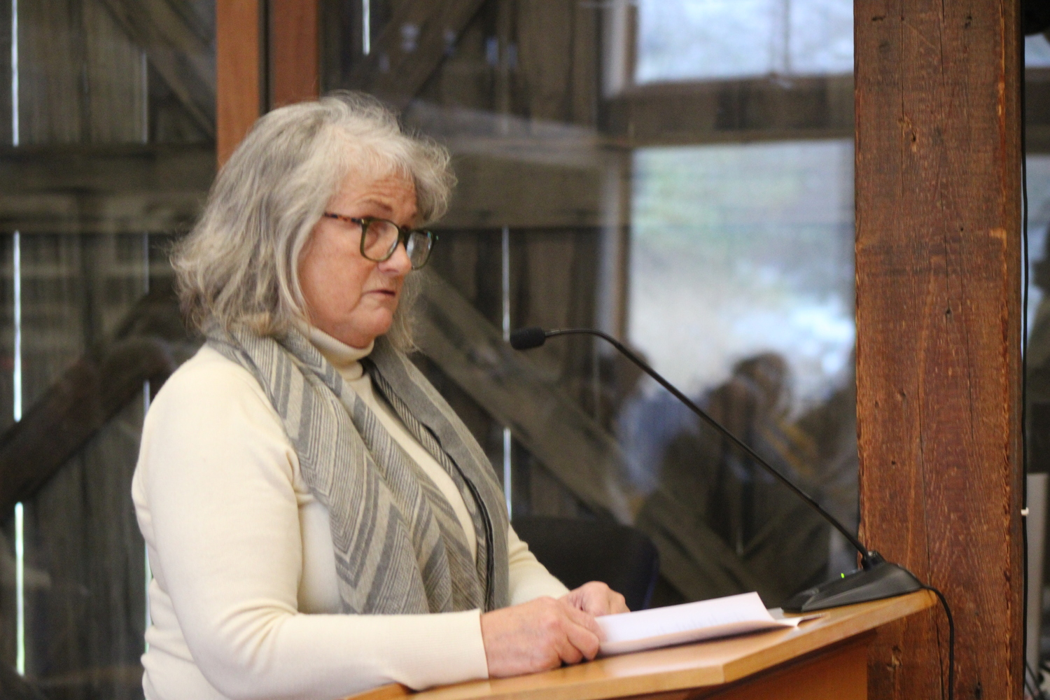 East Hampton Housing Authority Executive Director Catherine Casey was one of many who spoke out against the plans for a 79-unit development on Three Mile Harbor Road. JACK MOTZ