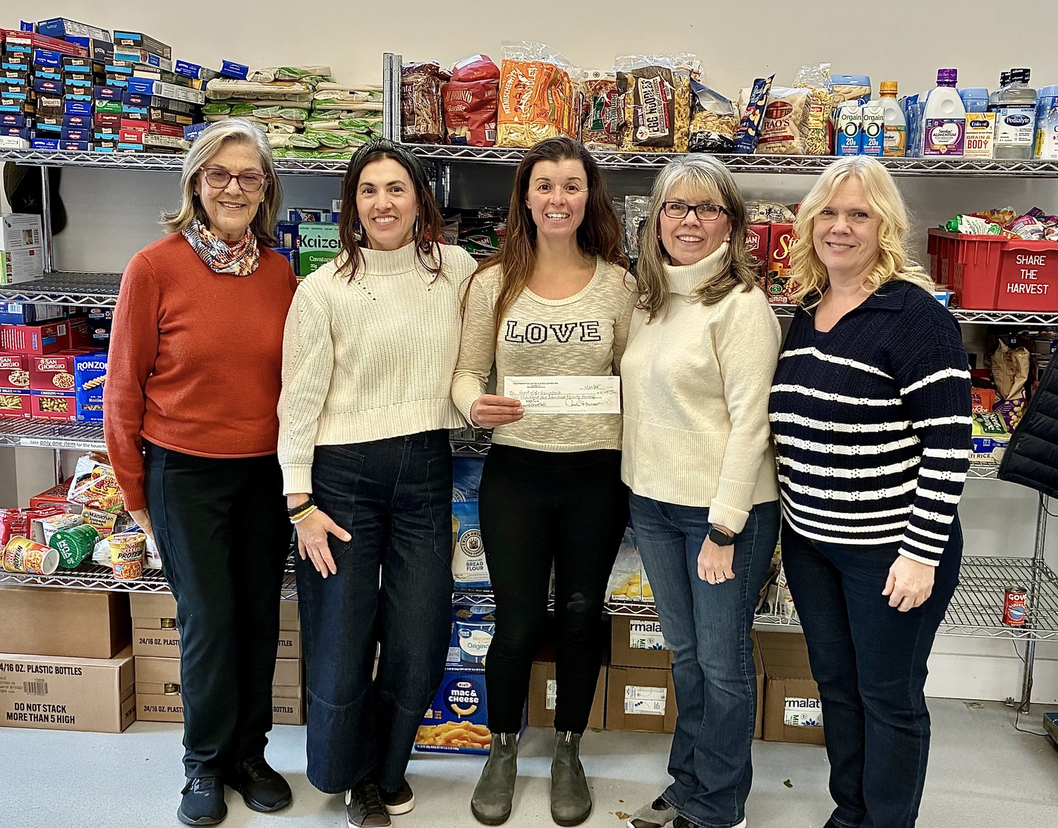 Southampton Artists Association presented a check for $10,125, raised by the sales at the Art of the Heart fundraiser, to Heart of the Hamptons food pantry.  From left, the association's Outreach Committee Chair Jean Mahoney, Heart of the Hamptons Program Coordinator Robin Preiato, Heart of the Hamptons Executive Director Molly Bishop, SAA Exhibition Committee Chair Diane White and SAA President Danielle Leef. COURTESY SOUTHAMPTON ARTISTS ASSOCIATION