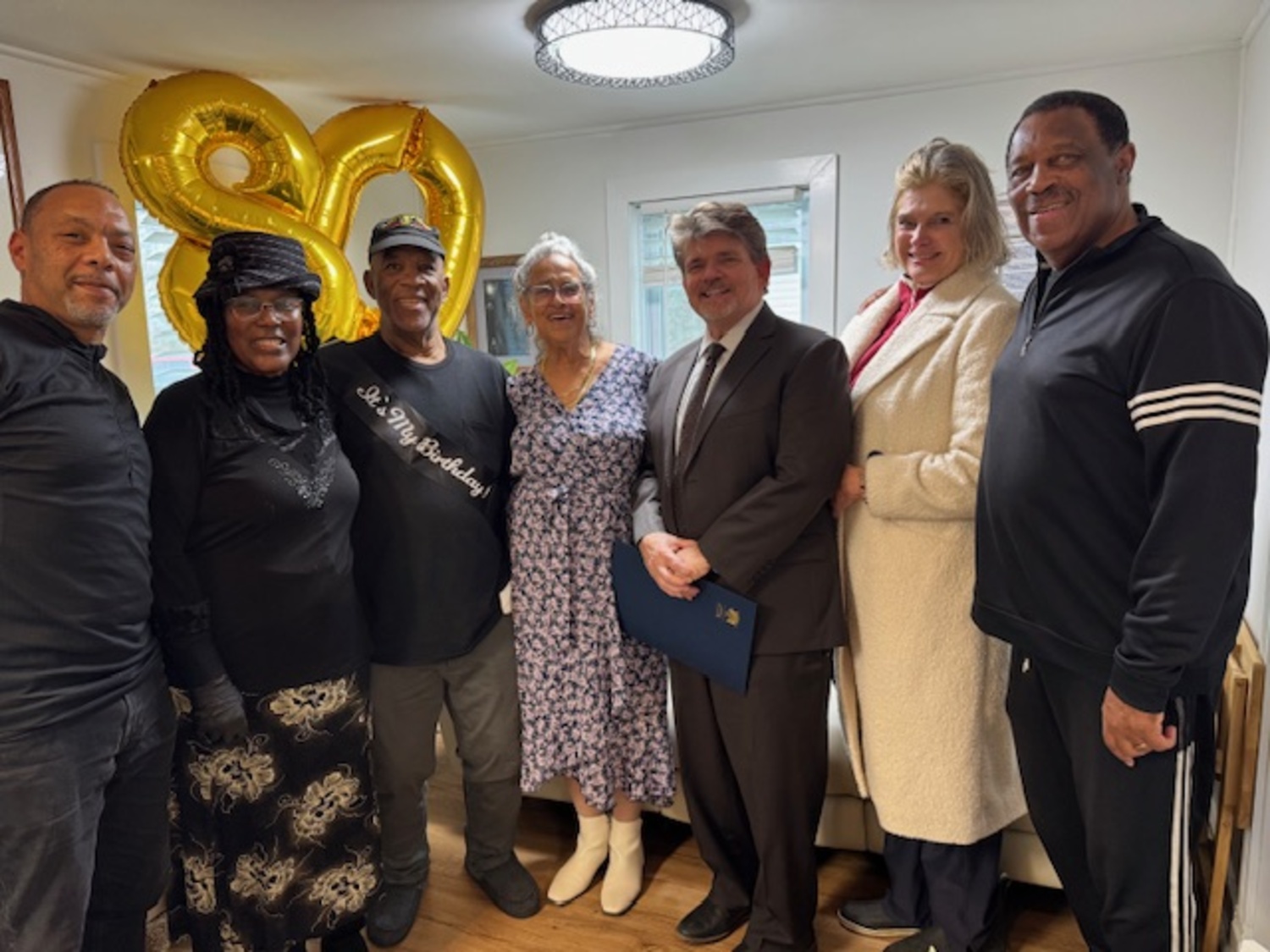 Odell Ferebee recently celebrated his 80th birthday at his Southampton home. At the gathering, he was presented with proclamations from the state and county, honoring his birthday milestone, as well as his service to the nation. He serviced two and a half tours, in Vietnam and Germany. From left, the Ferebees' nephew Sean Barrett, 
Odell and Lenore Ferebee, Pastor Octavia Johnson, New York State Assemblyman Tommy John Schiavoni Suffolk County Legislator  Ann Welker, and Juni Wingfield, a friend and fellow Vietnam veteran, COURTESY KIMBERLY ALLAN