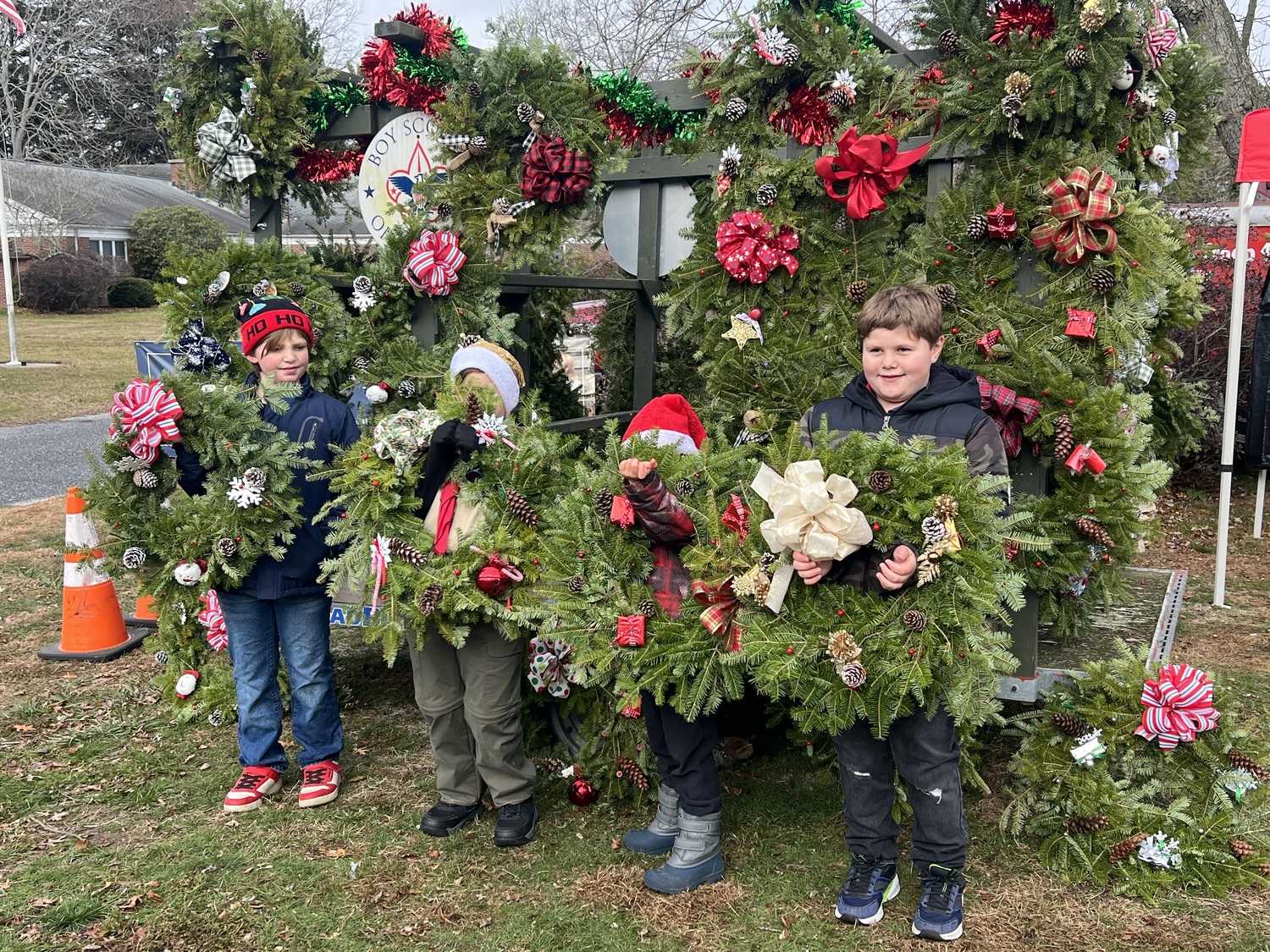 Members of Hampton Bays Scout Troop 483 were our selling wreaths for their annual fundraising sale last Saturday at the Hampton Bays United Methodist Church. COURTESY HEATHER HAYNIA