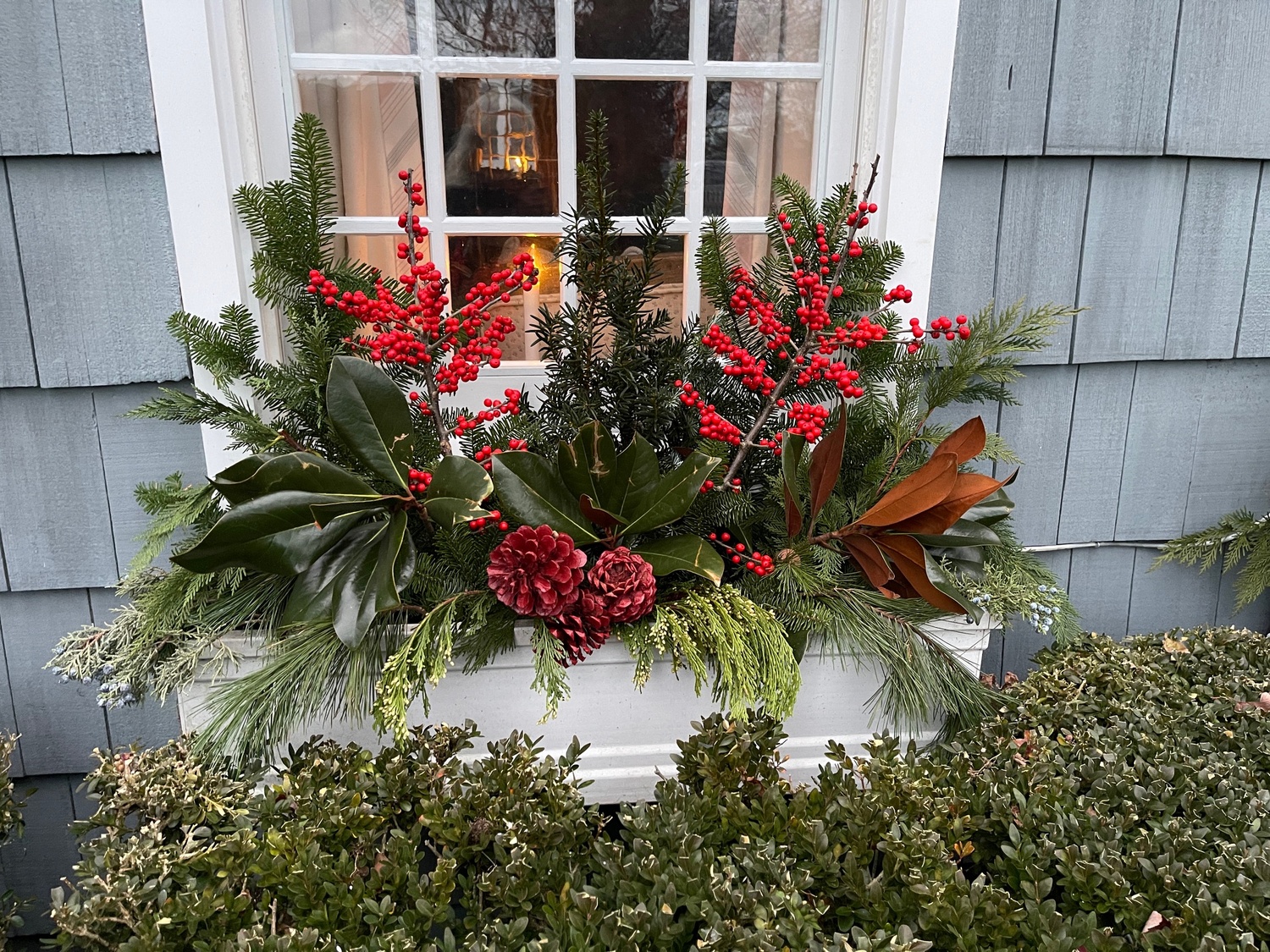 This festive window box shows off nature's greenery.